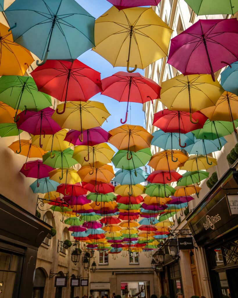 Commercial Ausbrella umbrella installed in outdoor restaurant patio with wind-resistant design